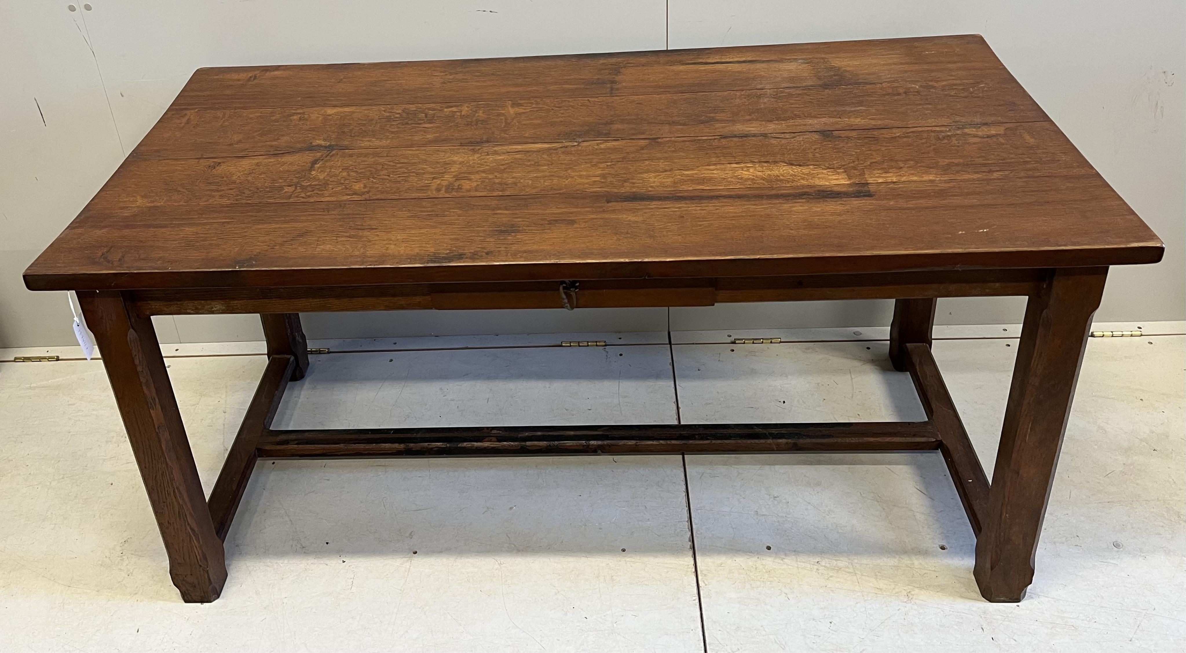 An early 20th century French rectangular oak kitchen table, on chamfered square legs, width 159cm, depth 74cm, height 76cm
